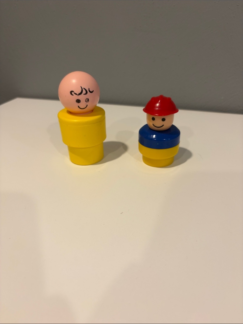 Fisher-Price Little People 1974 figure and 1990s firefighter figure